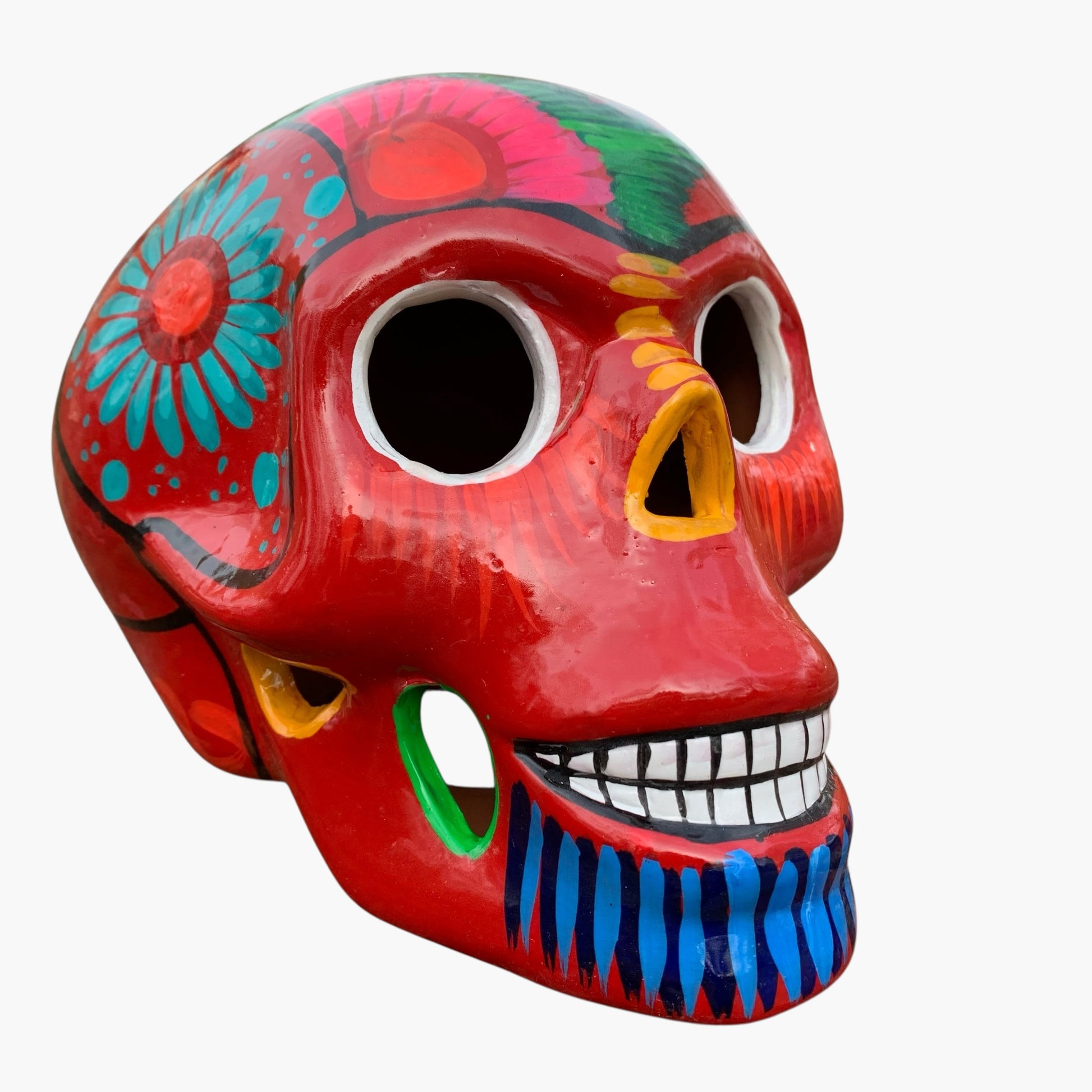 Colorful Mexican Sugar skull with vibrant designs on a white background