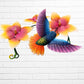 Metal hummingbird sculpture with Vibrant yellow flowers bottom view