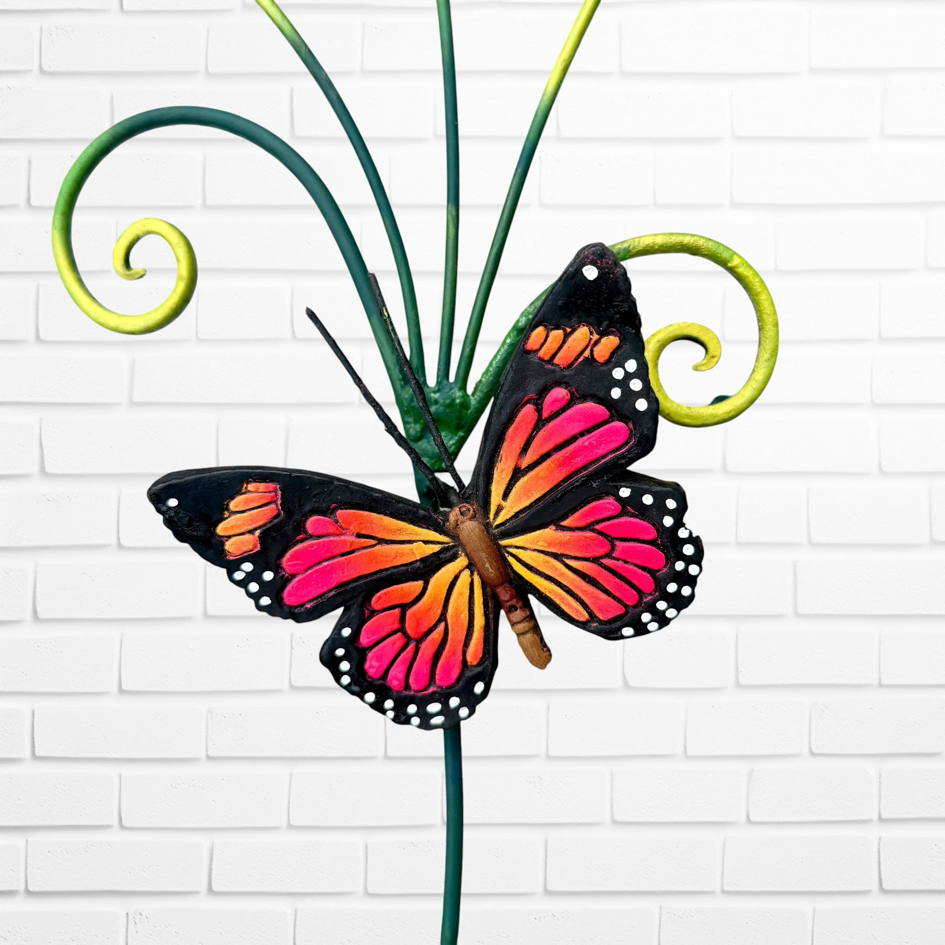A close-up of the butterfly included on the sculpture.