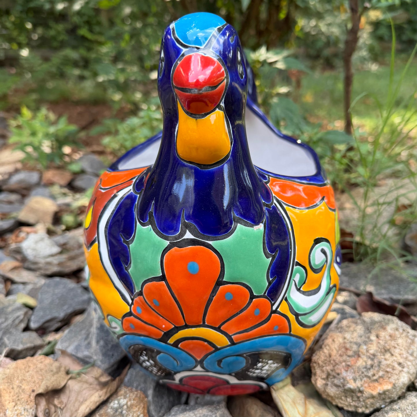 Colorful Mexican Talavera ceramic chicken shape planter on a natural background Front 
