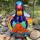 Colorful Mexican Talavera ceramic chicken shape planter on a natural background Front 