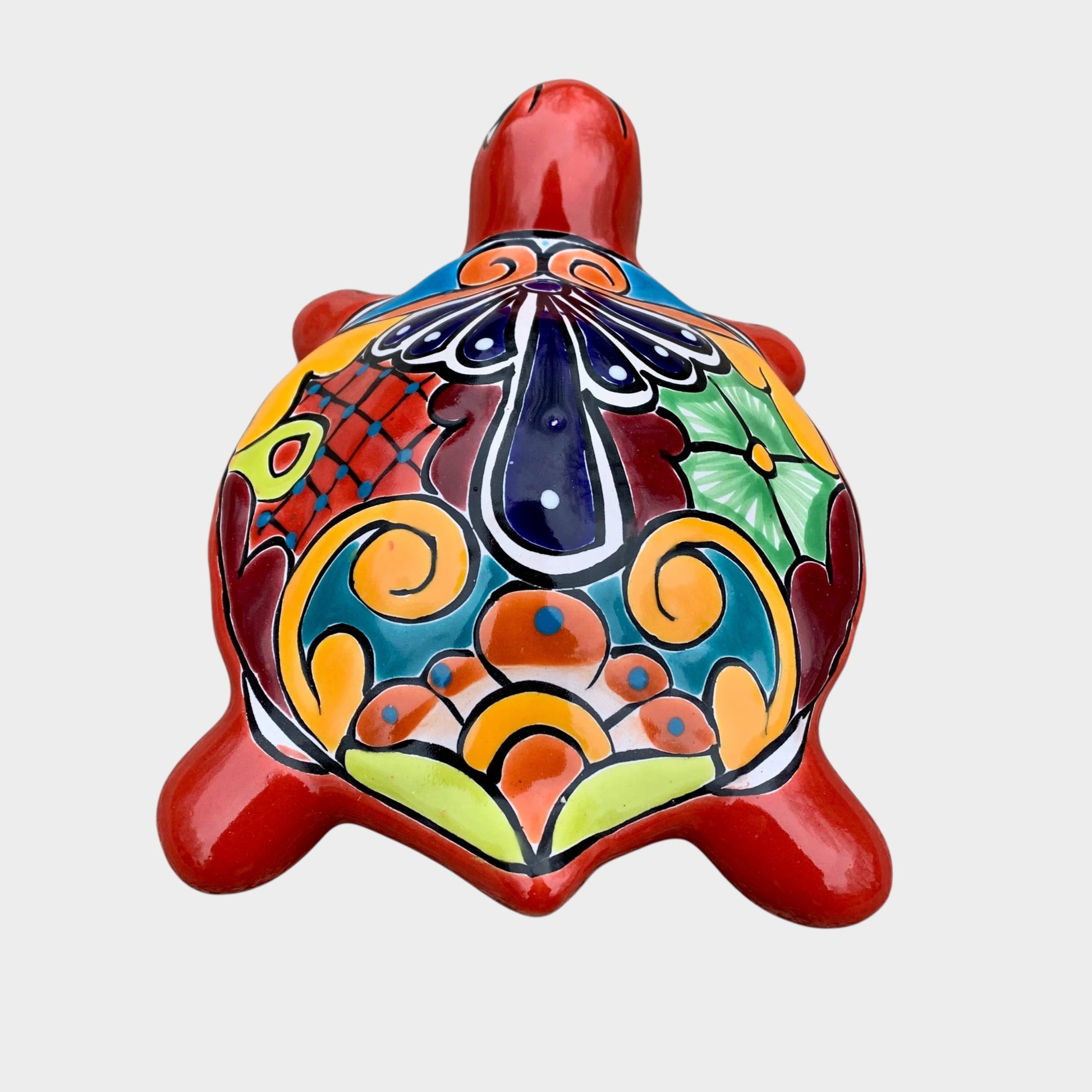 Colorful ceramic turtle on a white background back