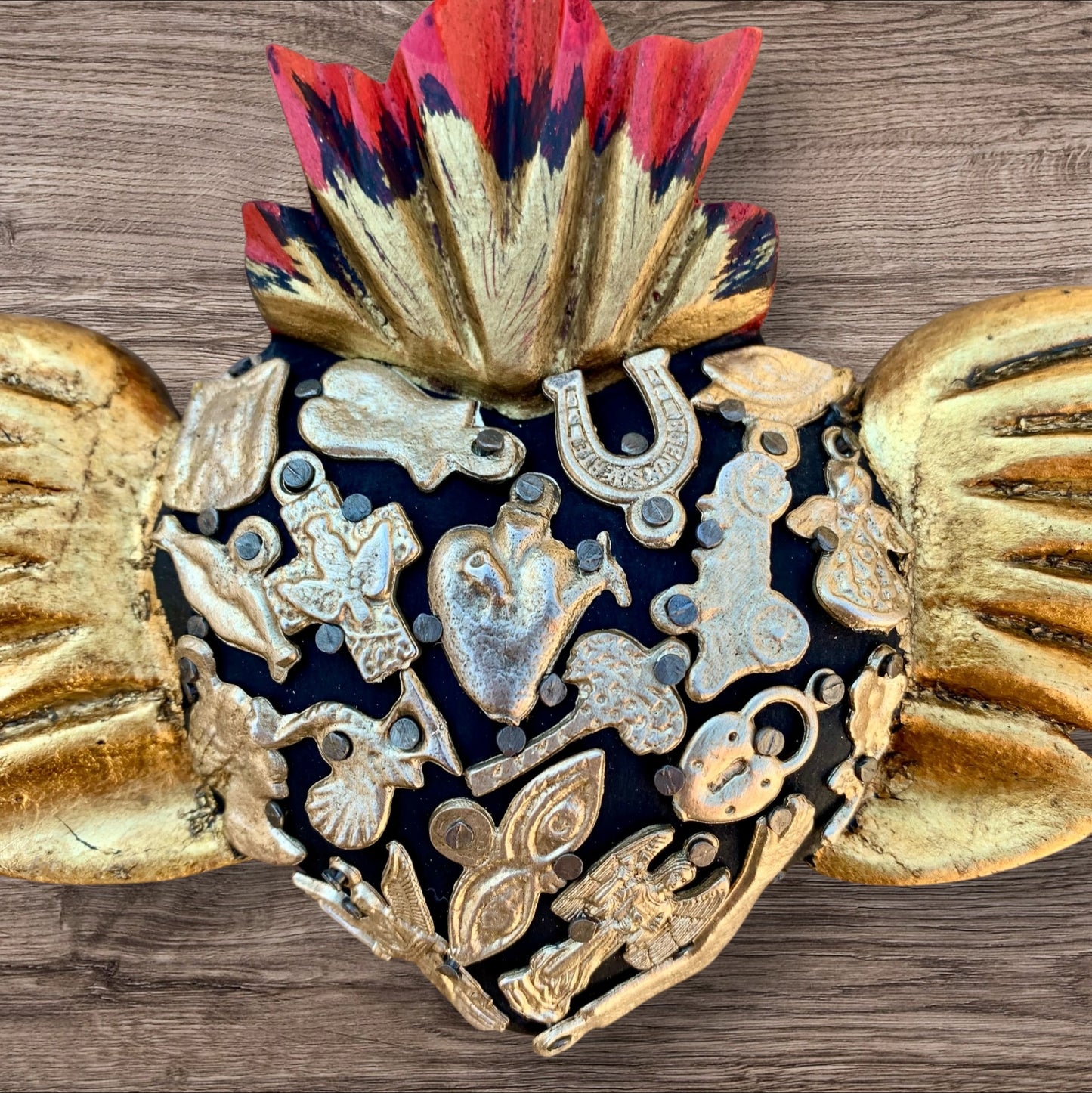 Milagros decorated flying sacred heart center