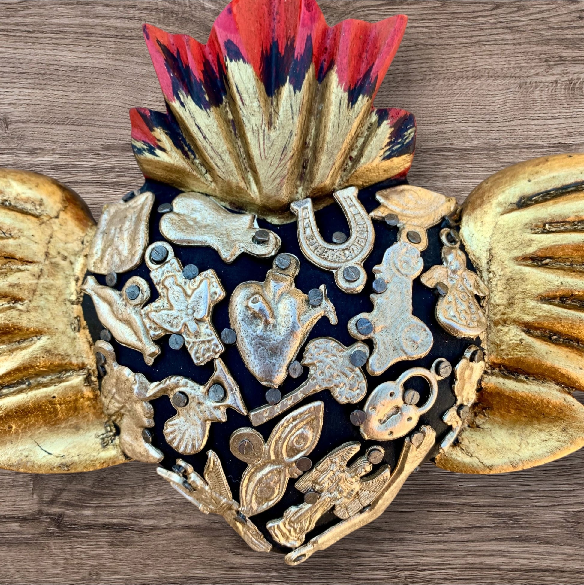 Milagros decorated flying sacred heart center