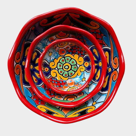 Three colorful talavera nesting bowls with intricate patterns