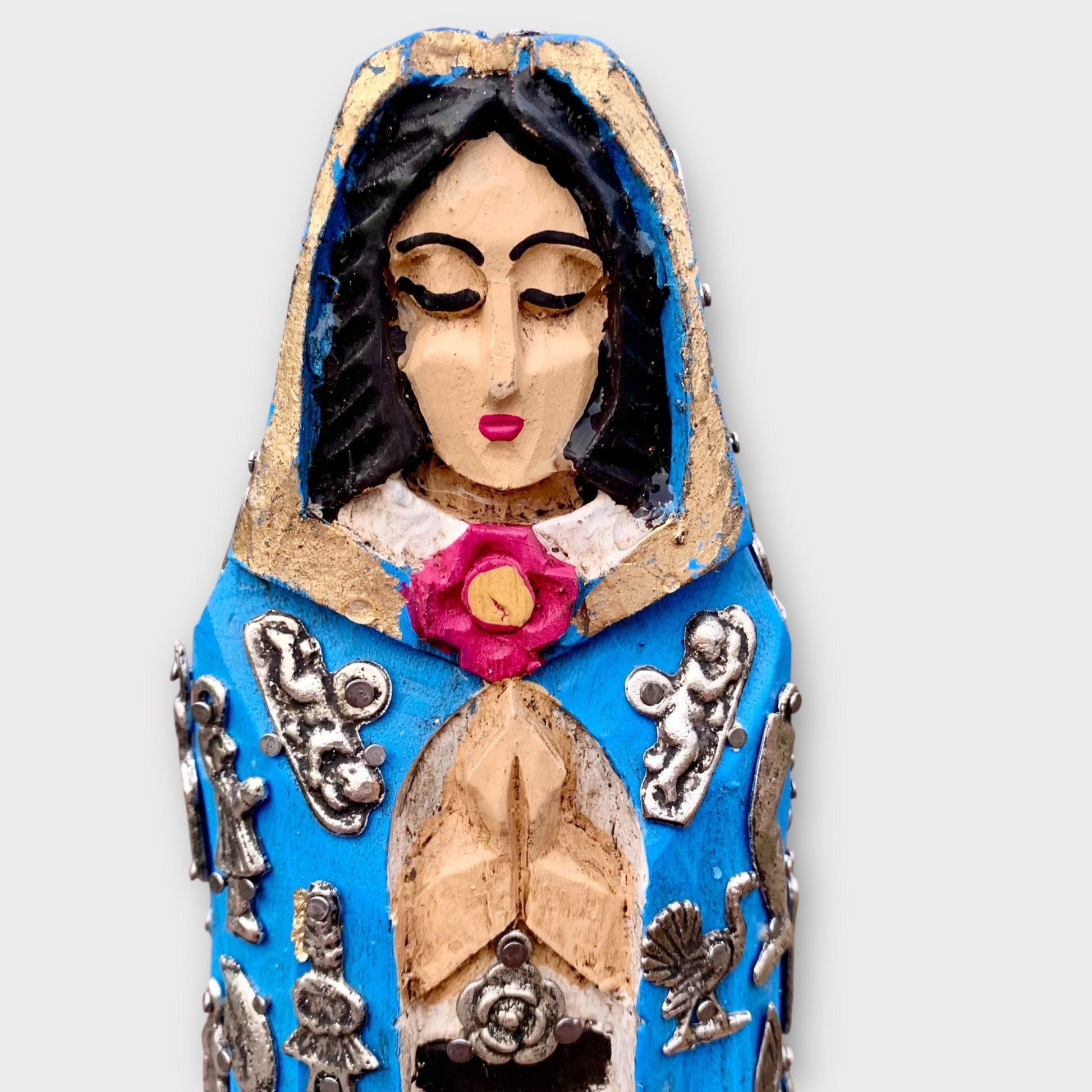 Milagros Virgin Maria face