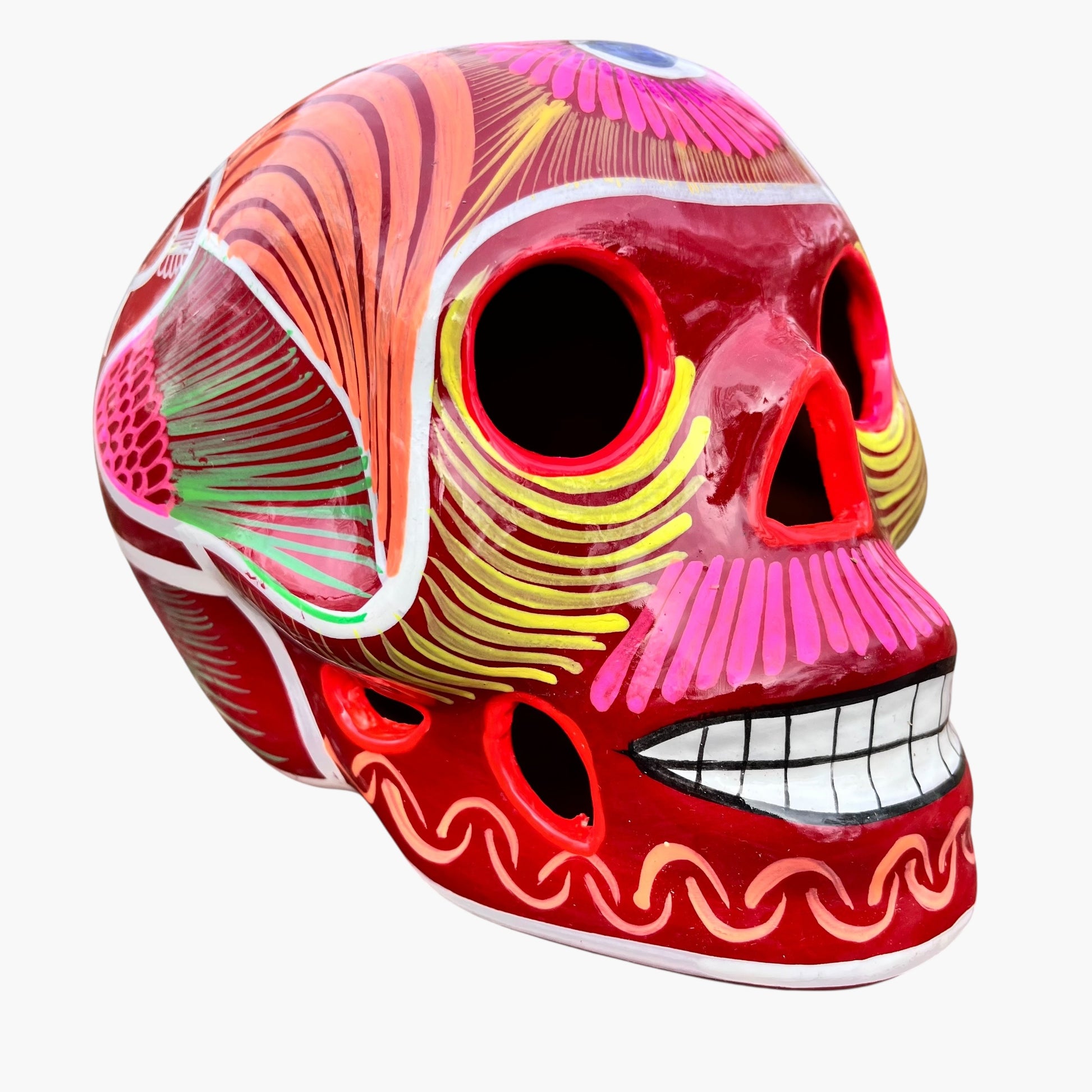 Colorful, Mexican sugar skull multicolor designs on red background