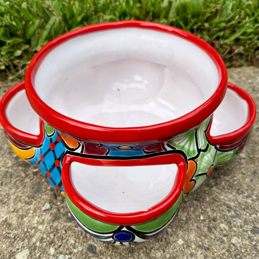 Hand painted Mexican Talavera Strawberry pot with a large top opening a four pockets on each side.  Trim color is bright red, body has multi-color designs.