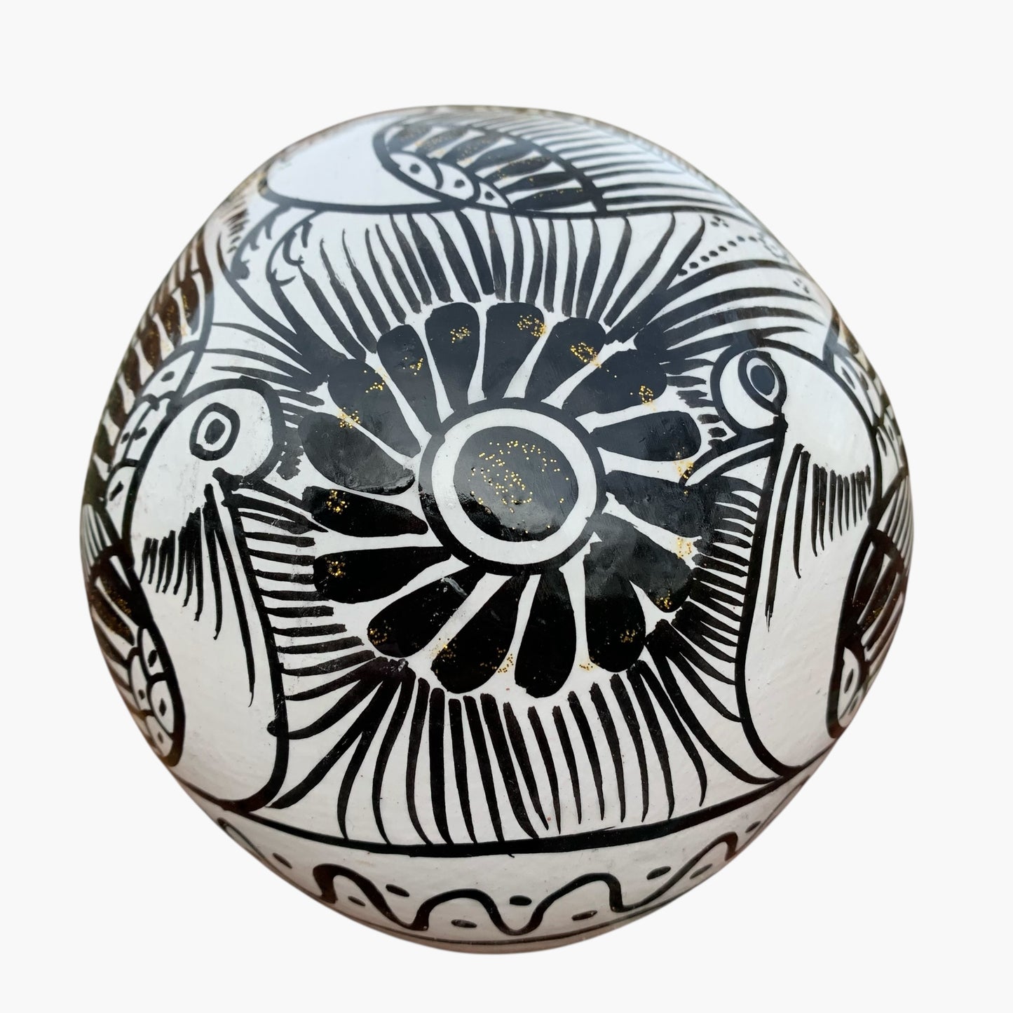 Black and whiteMexican Sugar skull with vibrant designs on a white background back view