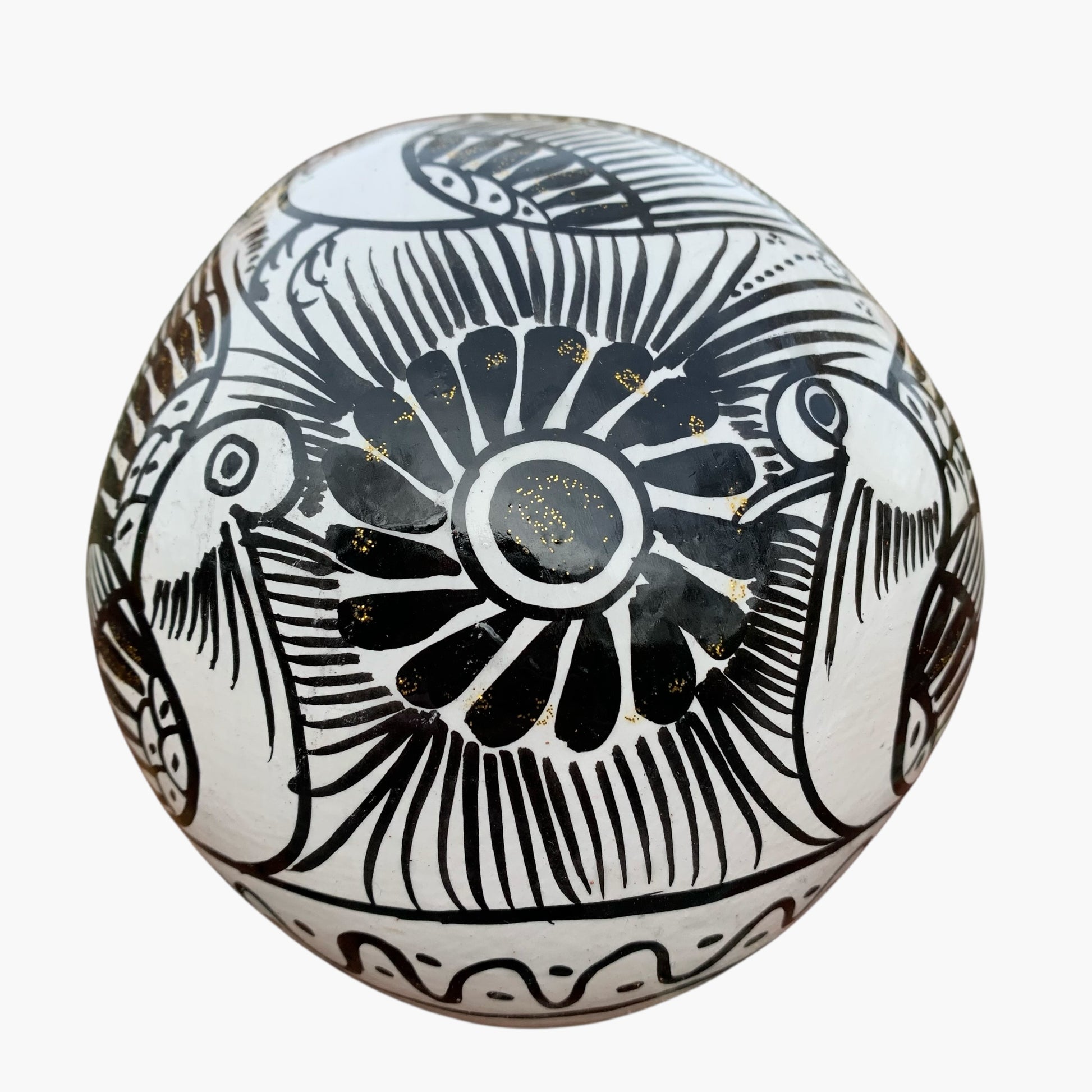 Black and whiteMexican Sugar skull with vibrant designs on a white background back view