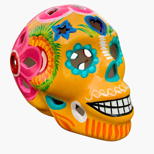 Colorful Yellow Multi Color Mexican Sugar skull with vibrant designs on a white background