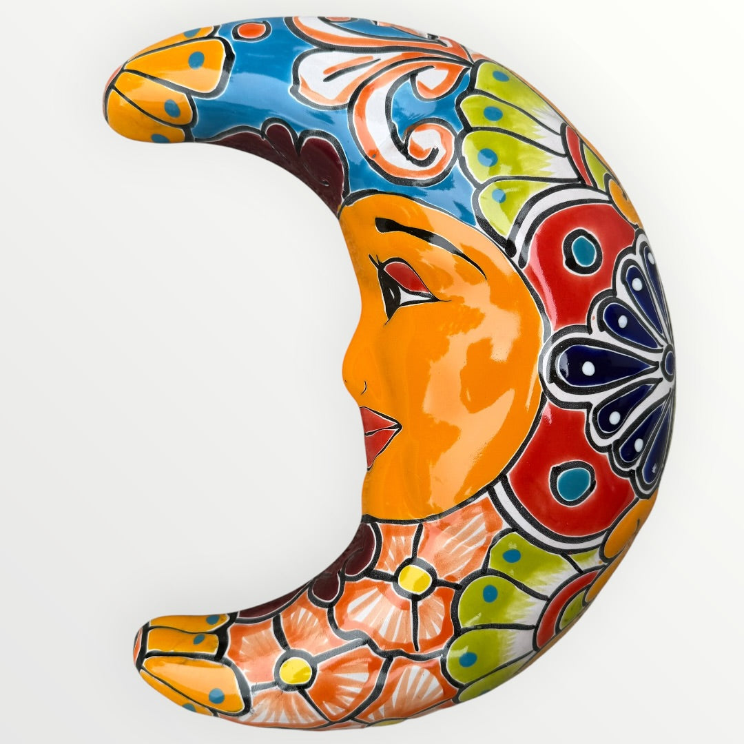 Decorative ceramic moon with colorful patterns on a white background