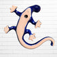 back of salamander lizard showing opening to hand on wall.