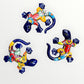 Three colorful ceramic lizards on a white background