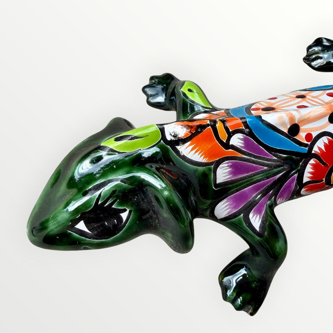 Mexican Talavera wall mounted iguana in dark green with multicolor designs face.