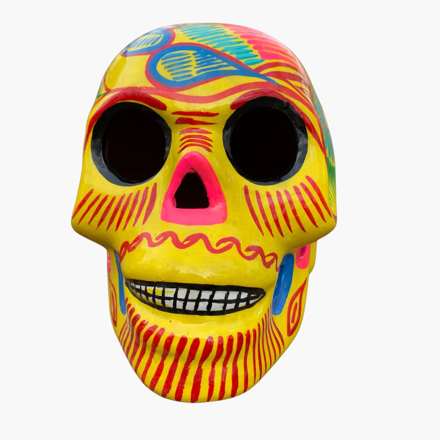 Colorful Mexican Sugar skull yellow with vibrant designs on a white background front