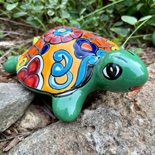 Colorful  Mexican Talavera ceramic turtle figurine on a natural background