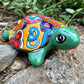 Colorful  Mexican Talavera ceramic turtle figurine on a natural background