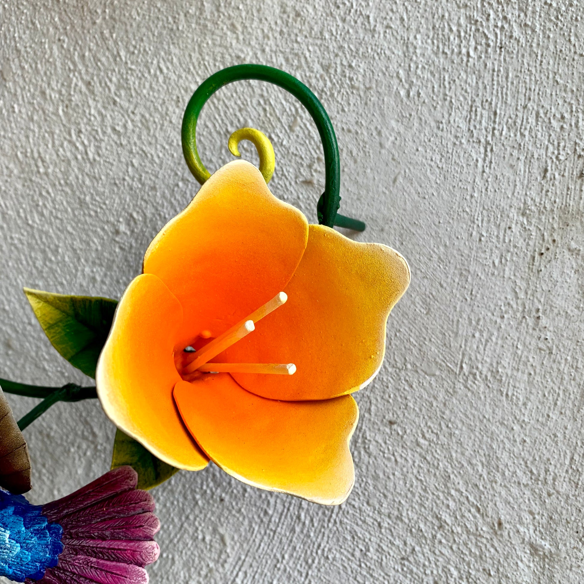 Hummingbirds with yellow flowers sculpture