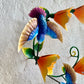 Hummingbirds with yellow flowers sculpture