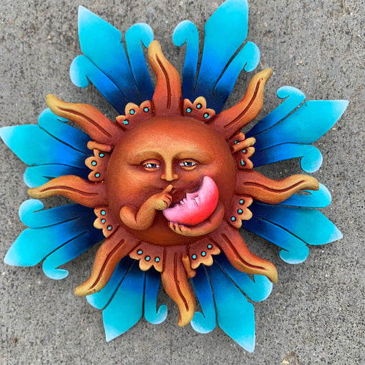 Sun and sleeping moon metal sculpture