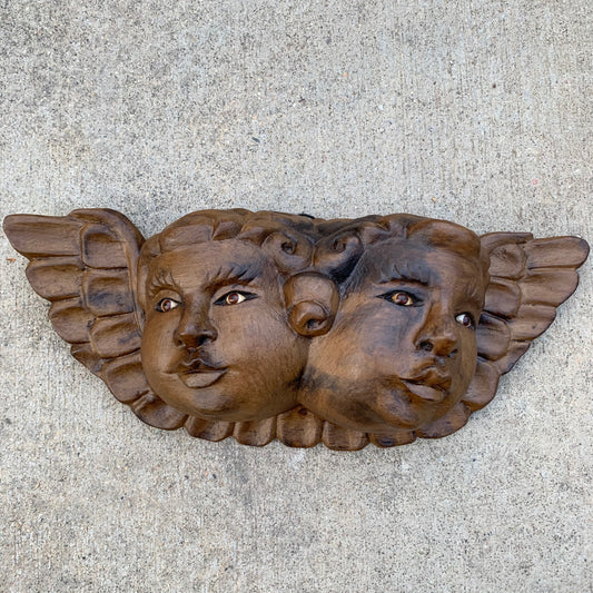carved wood cherub