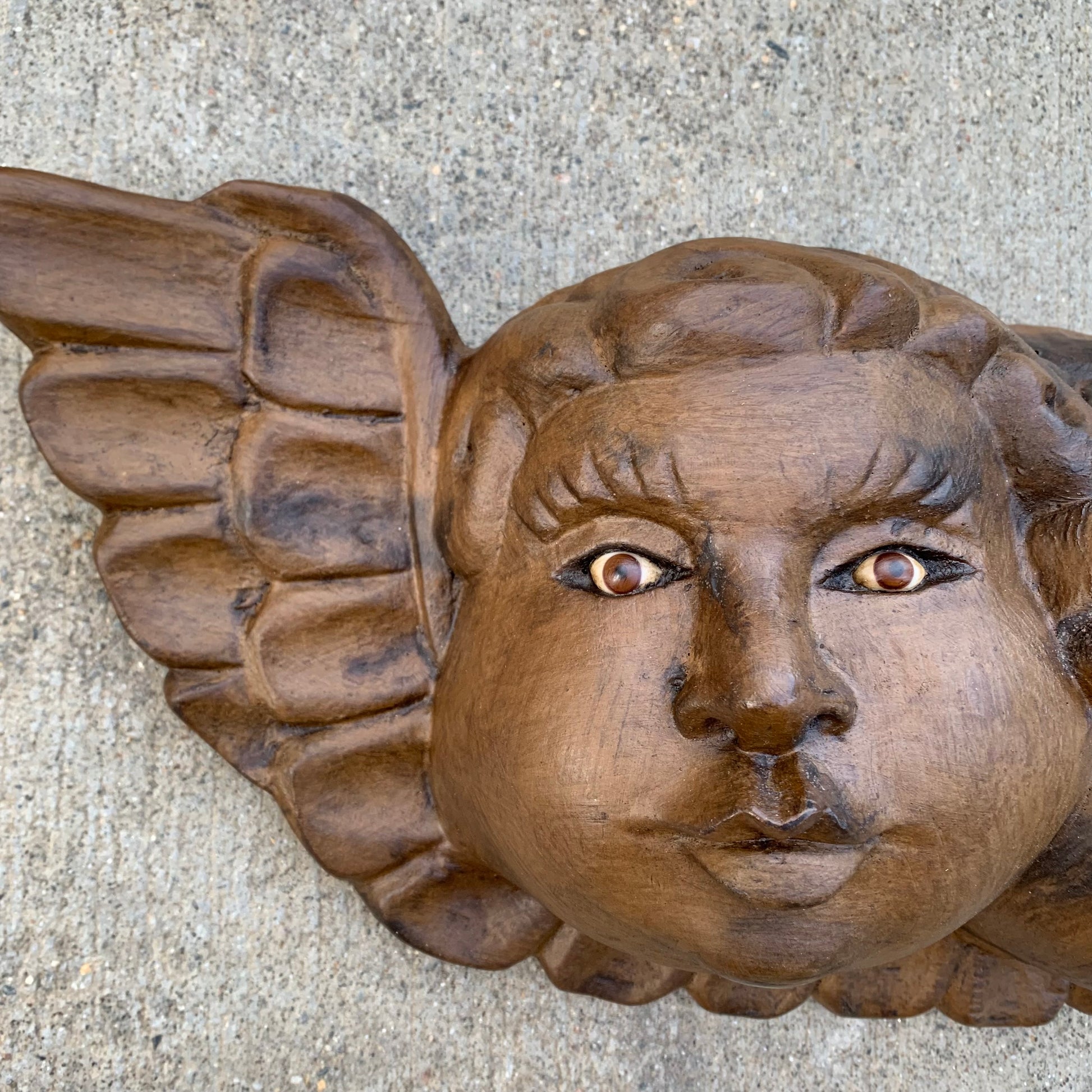 wood cherub face with wing
