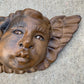 wood cherub face with wing